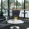 Spacious and well lit lobby with plenty of seating and large windows with a view of the city 