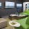 Spacious and well lit clubroom with three TV's and plenty of seating