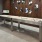 Large game room with multiple tables and tvs and a shuffle board table