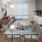 Spacious and well lit Dining Area with wood floors and stainless steel appliances. 