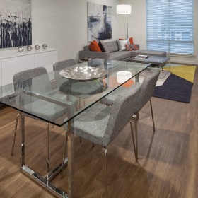 Dining Area Spacious and well lit dining room with wood floors and an open floor plan with access to the kitchen.